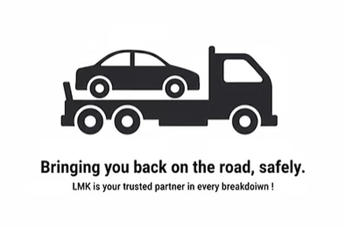 Recovery truck carrying a car, illustrating LMK vehicle recovery