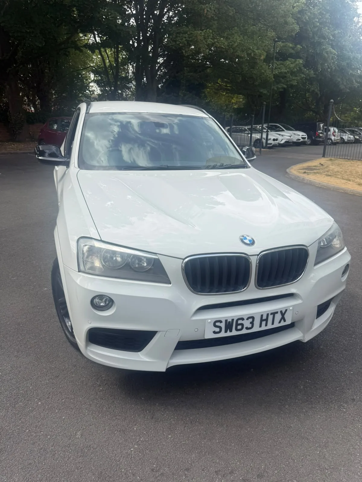 Front and side view of the BMW X3 with black alloy wheels