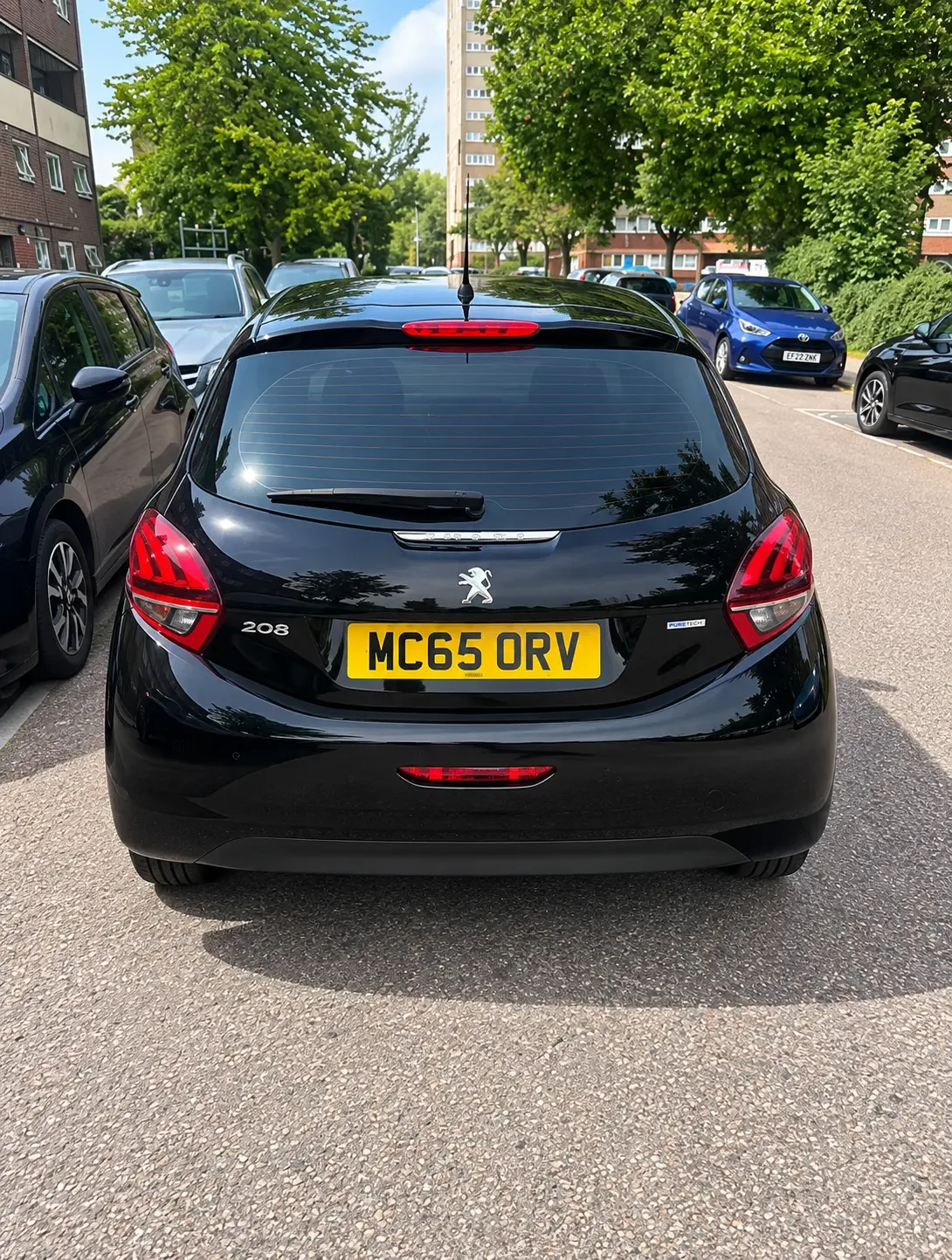 Peugeot 208 rear view showing tailgate, lights and registration MC65 ORV
