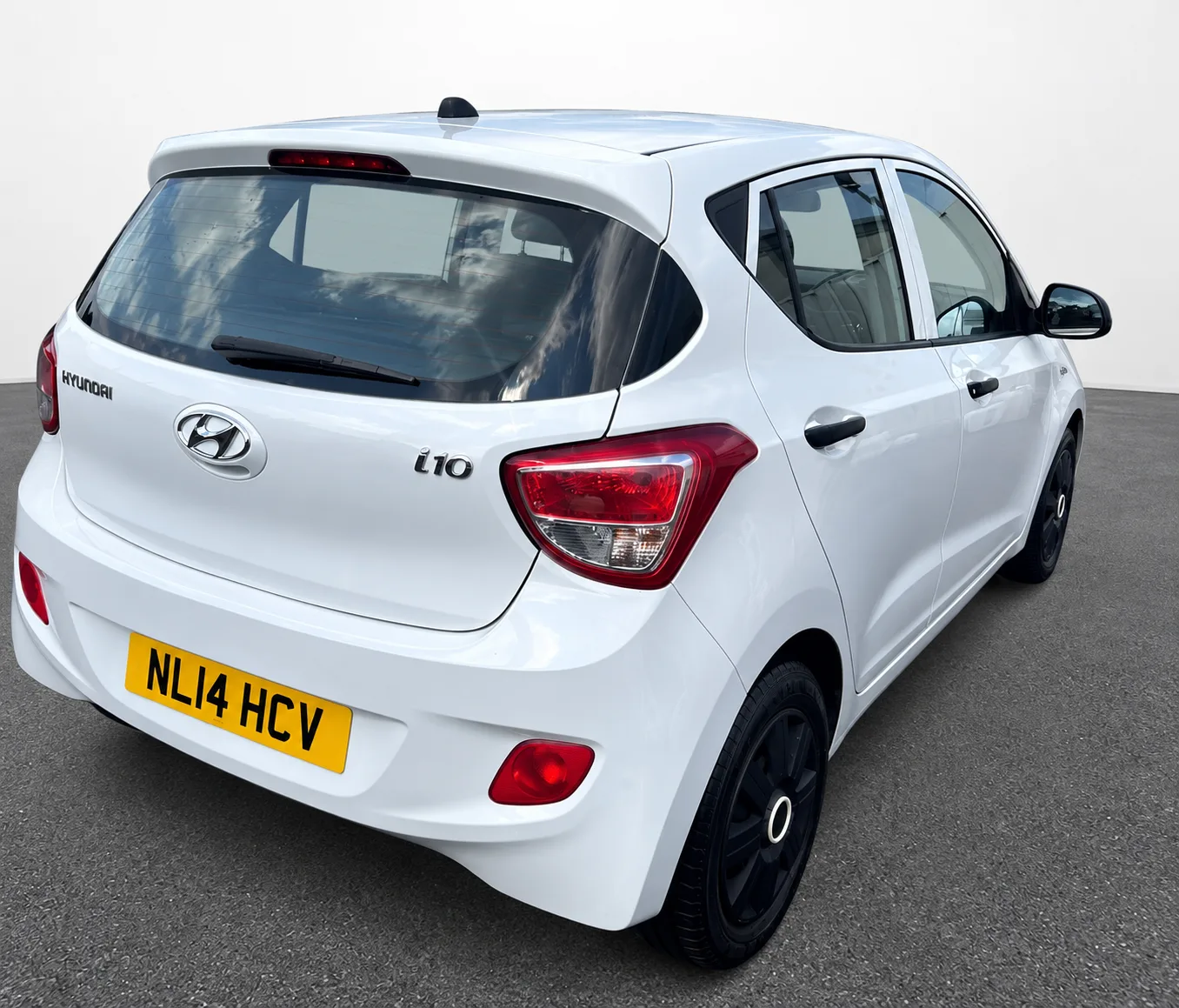 White Hyundai i10, rear three quarter exterior view