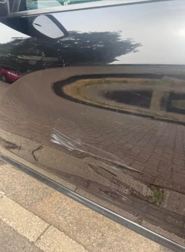 Condition photograph showing cosmetic scratches and scuffing on the bodywork of the Peugeot 208