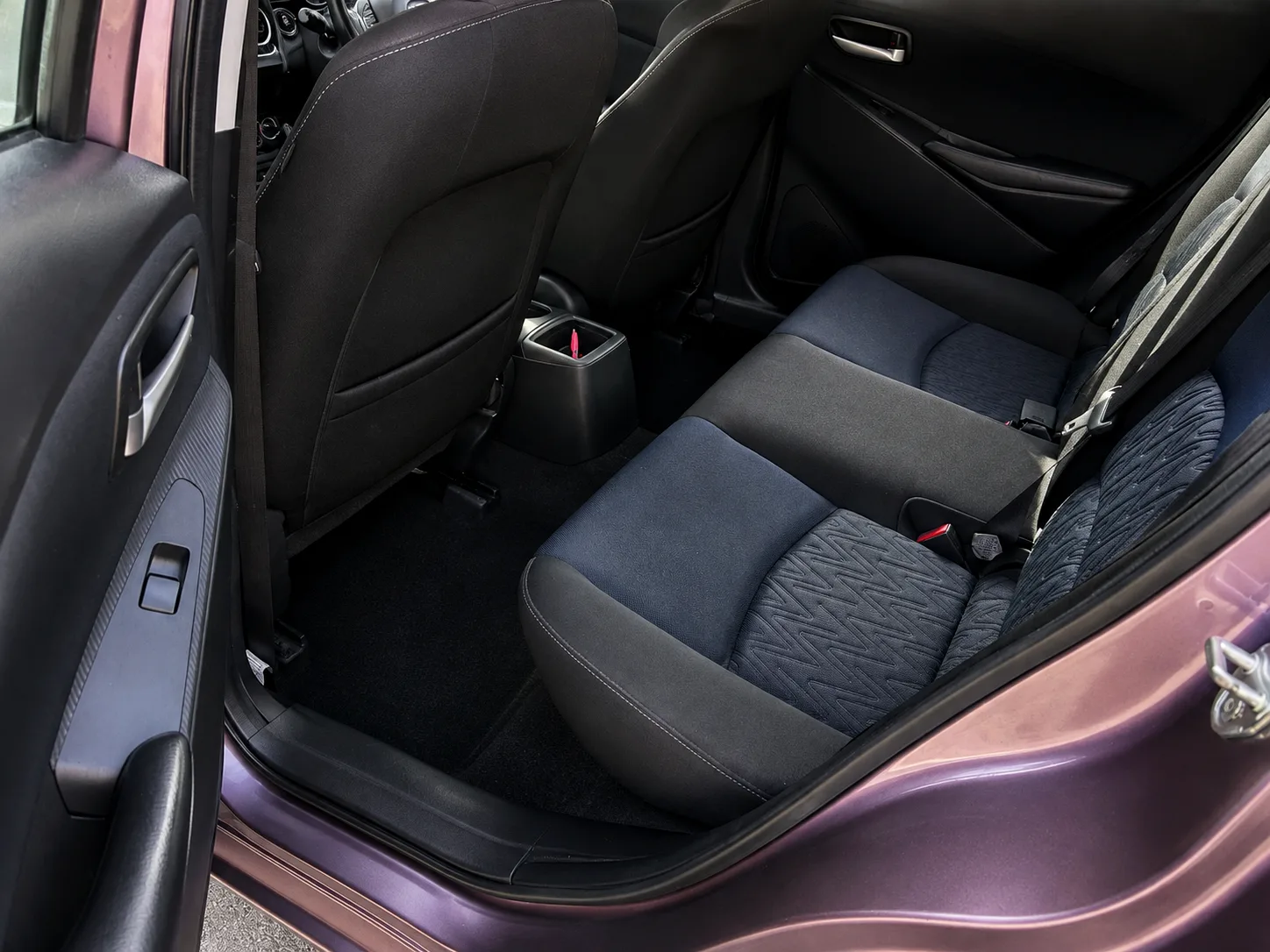 Mazda2 SE-L rear seats and cloth upholstery with rear door open