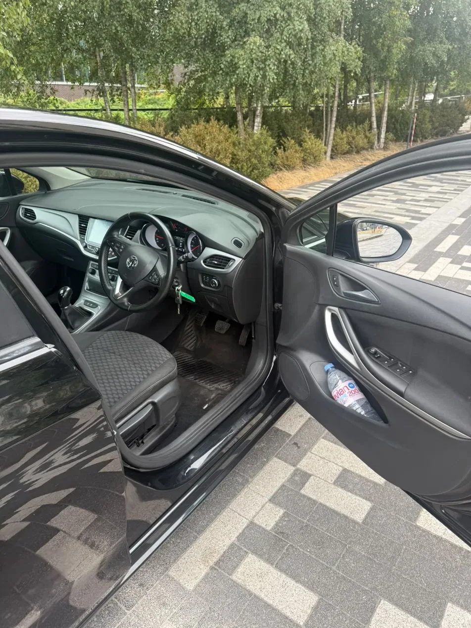 Driver side interior showing seats, steering wheel and pedals
