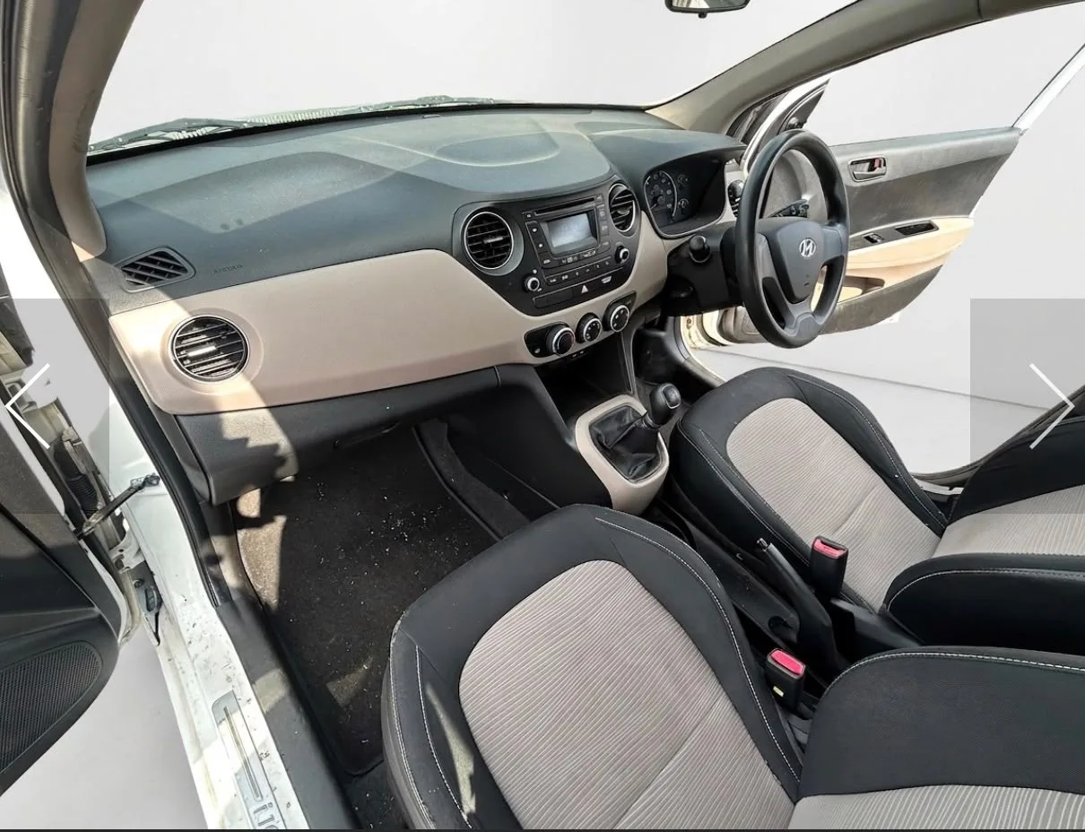 White Hyundai i10, front view of the car