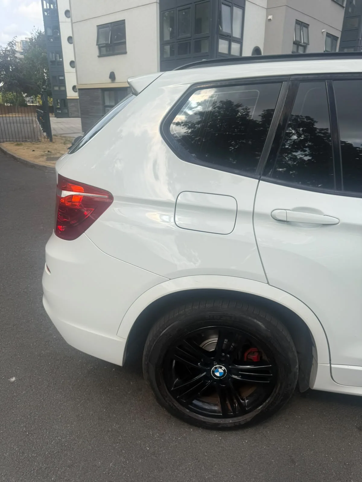 Rear quarter with genuine BMW M Sport black alloy wheel
