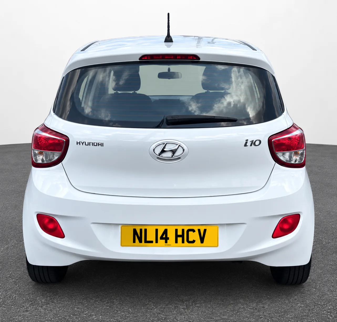 White Hyundai i10, straight rear view